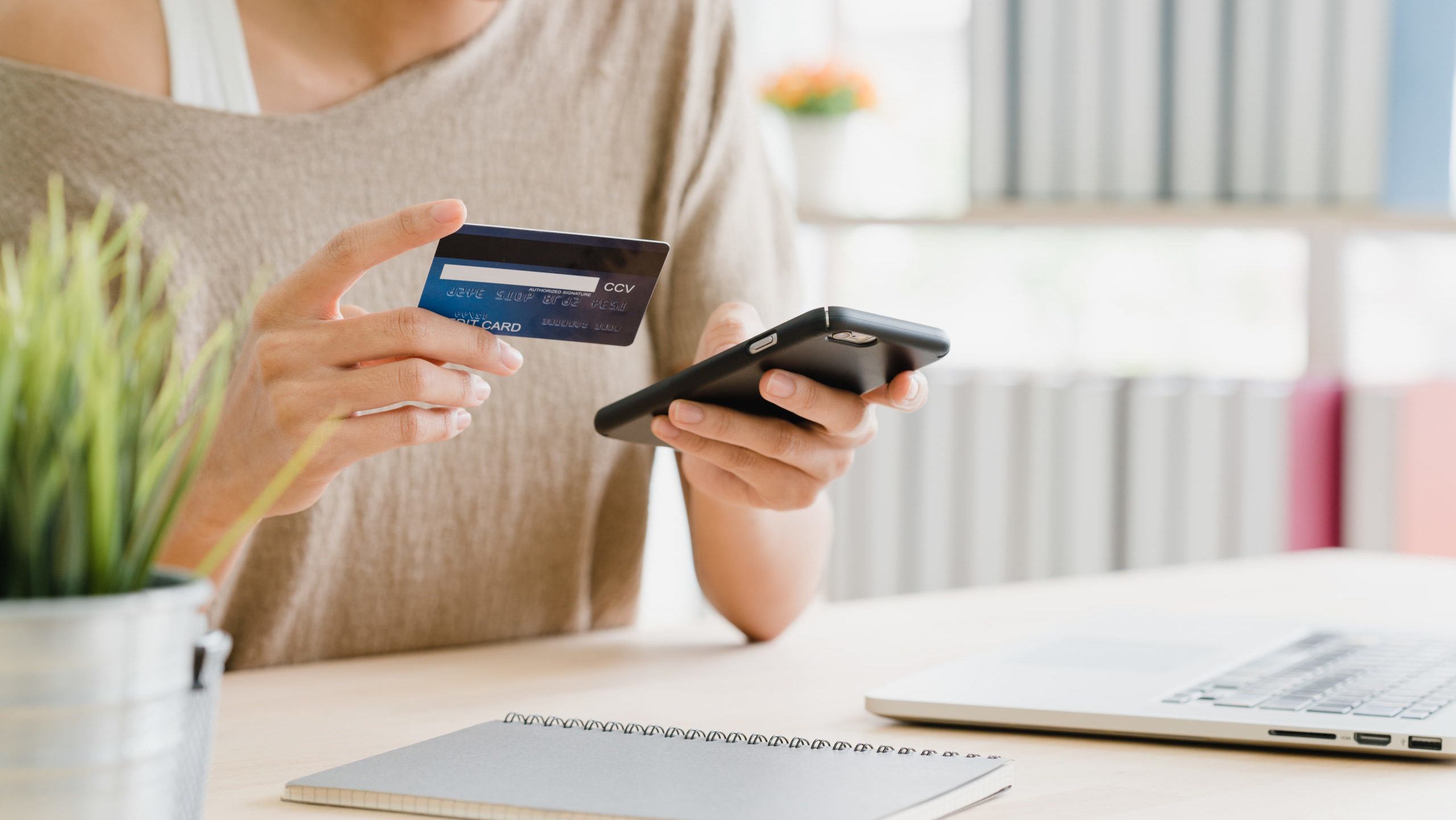 cropped beautiful asian woman using smartphone buying online shopping scaled 2
